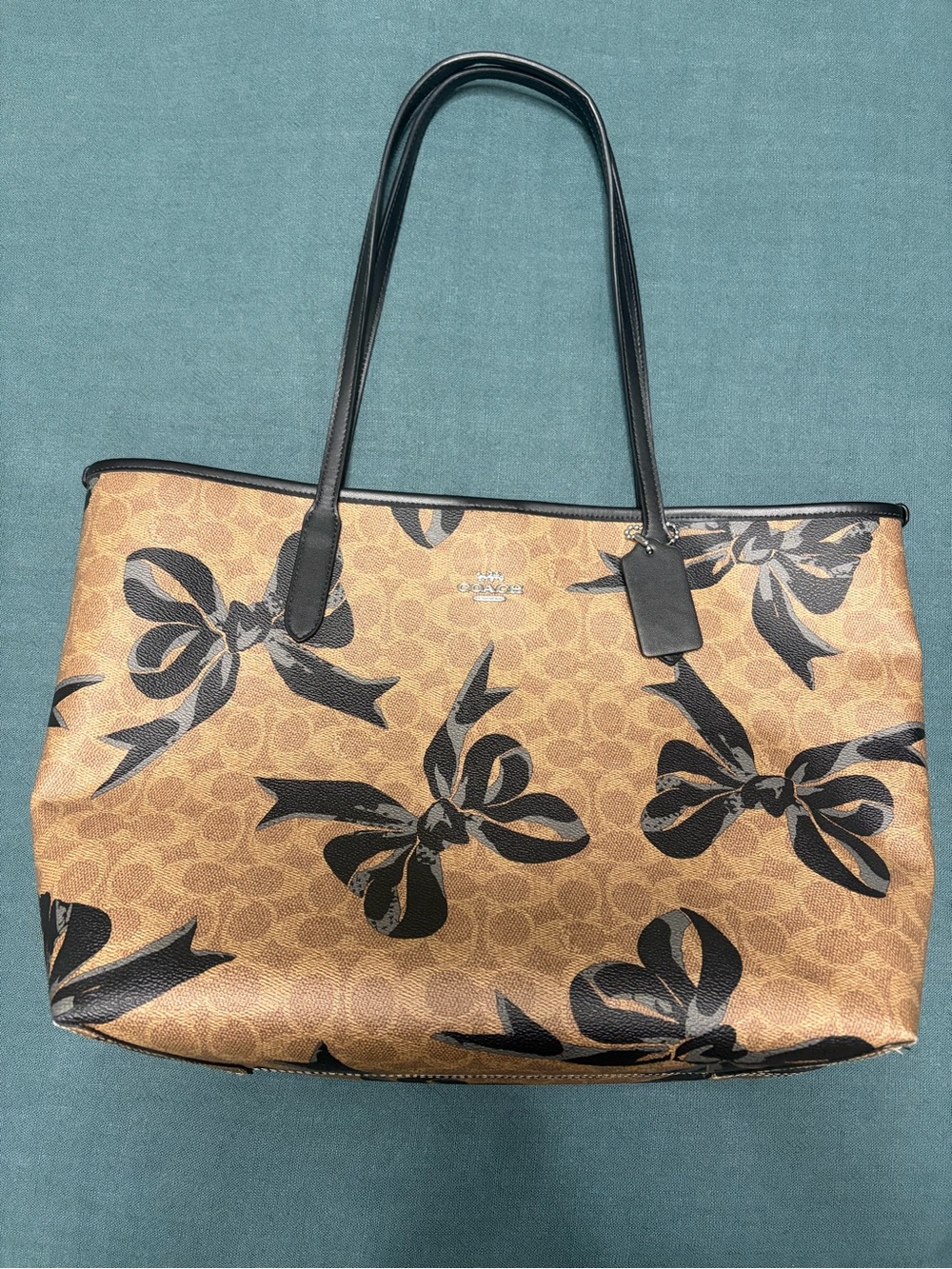 Coach Tan Signature Canvas Tote with Black Bow Motif